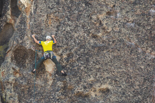 man-doing-outdoor-rock-climbing man-doing-outdoor-rock-climbing