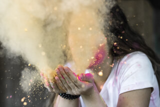 woman-in-white-cap-sleeved-shirt-blowing-dust woman-in-white-cap-sleeved-shirt-blowing-dust
